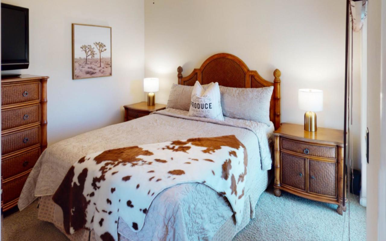 80777 Calle Azul La Quinta, CA 92253 - Photo 12 of 39 a bed with a bed and a painting on the wall