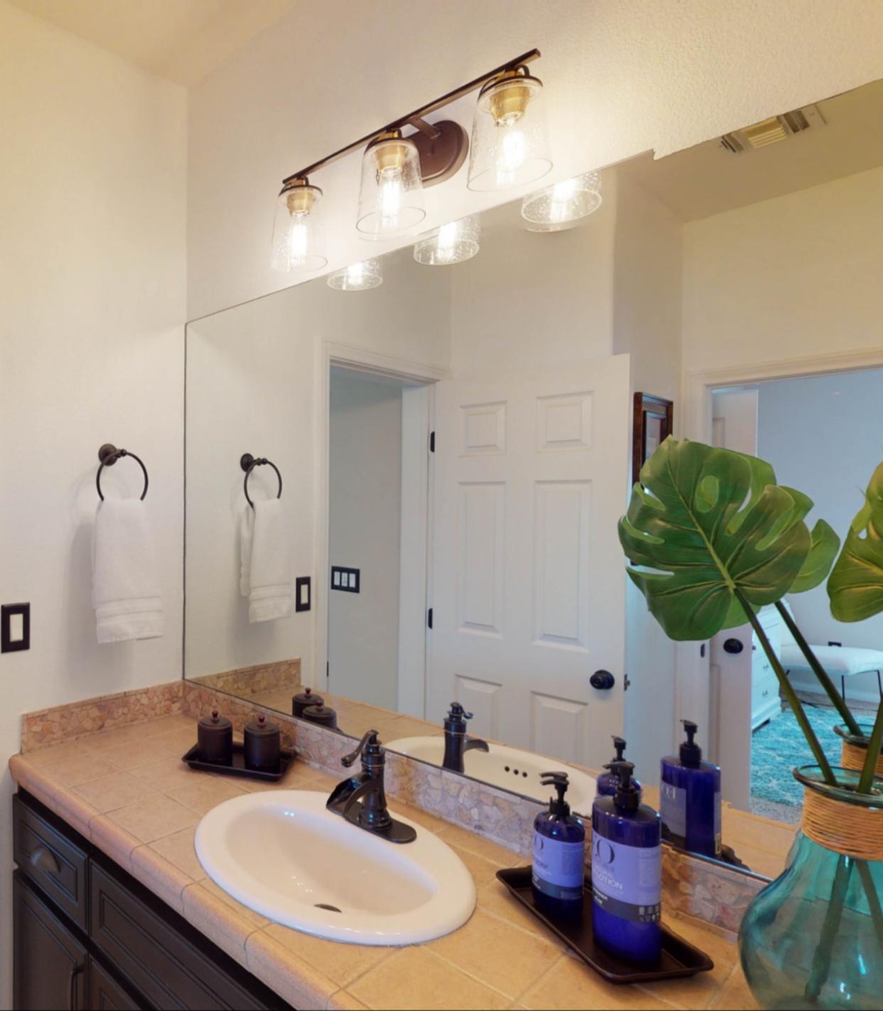 80777 Calle Azul La Quinta, CA 92253 - Photo 13 of 39 a bathroom with a sink and a mirror