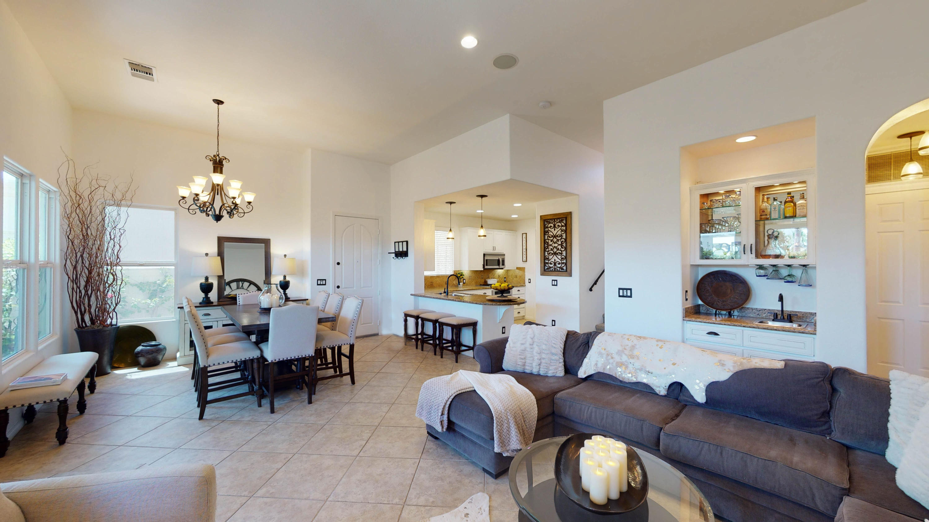 80777 Calle Azul La Quinta, CA 92253 - Photo 3 of 39 a living room with furniture a chandelier and a fireplace
