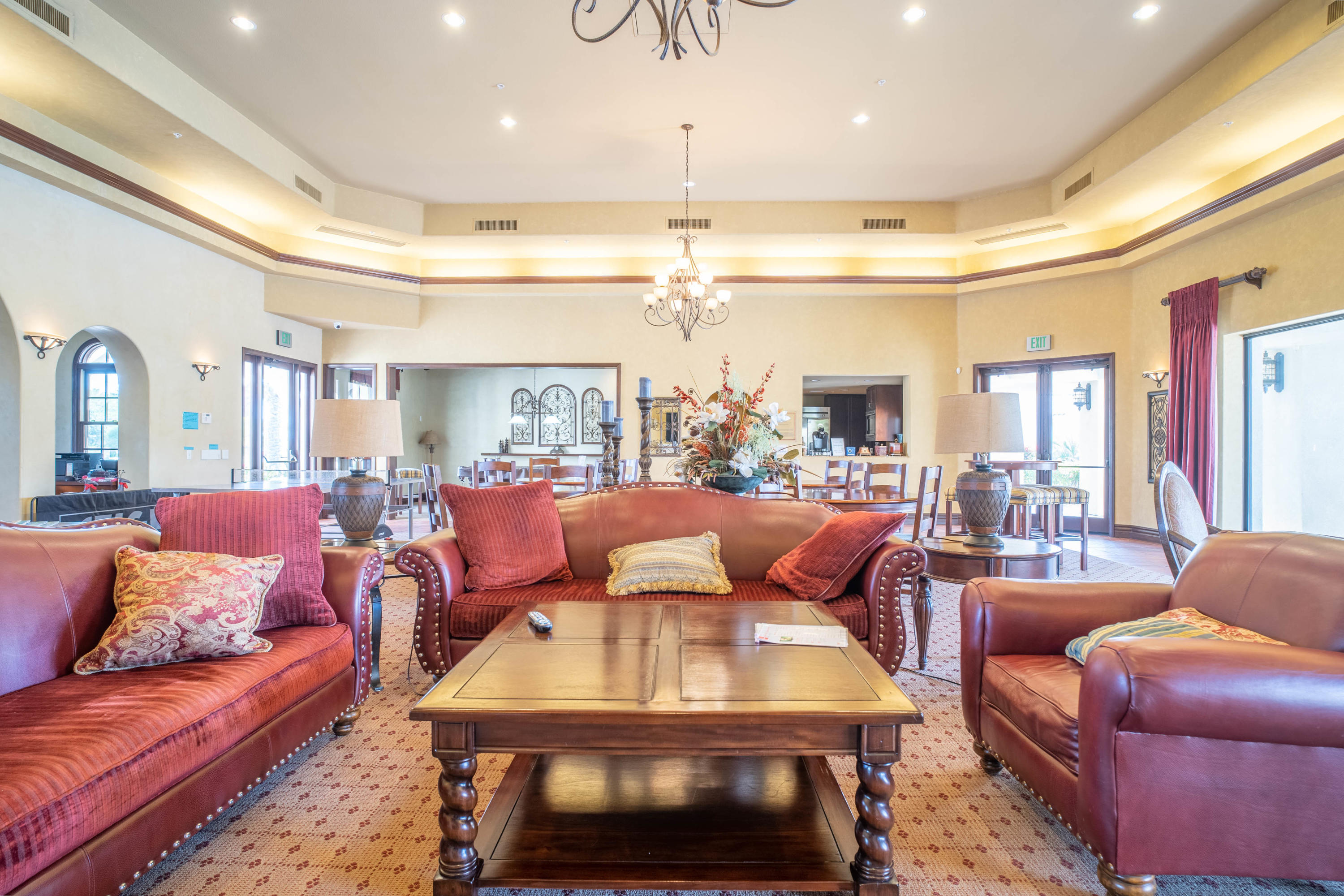 80777 Calle Azul La Quinta, CA 92253 - Photo 29 of 39 a living room with furniture a rug and a chandelier