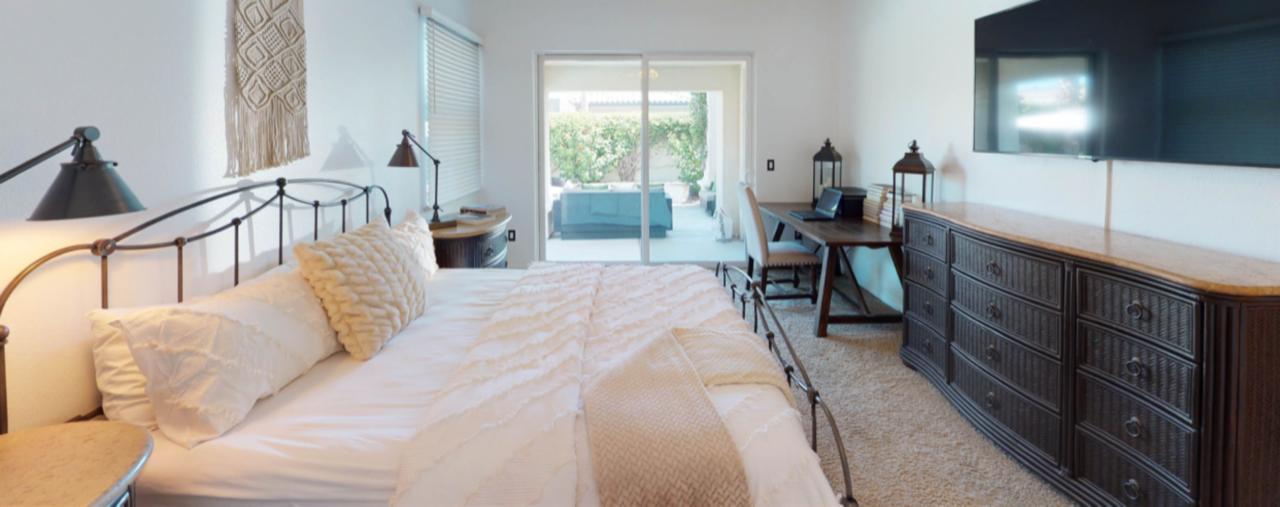 80777 Calle Azul La Quinta, CA 92253 - Photo 7 of 39 a bedroom with furniture and a window