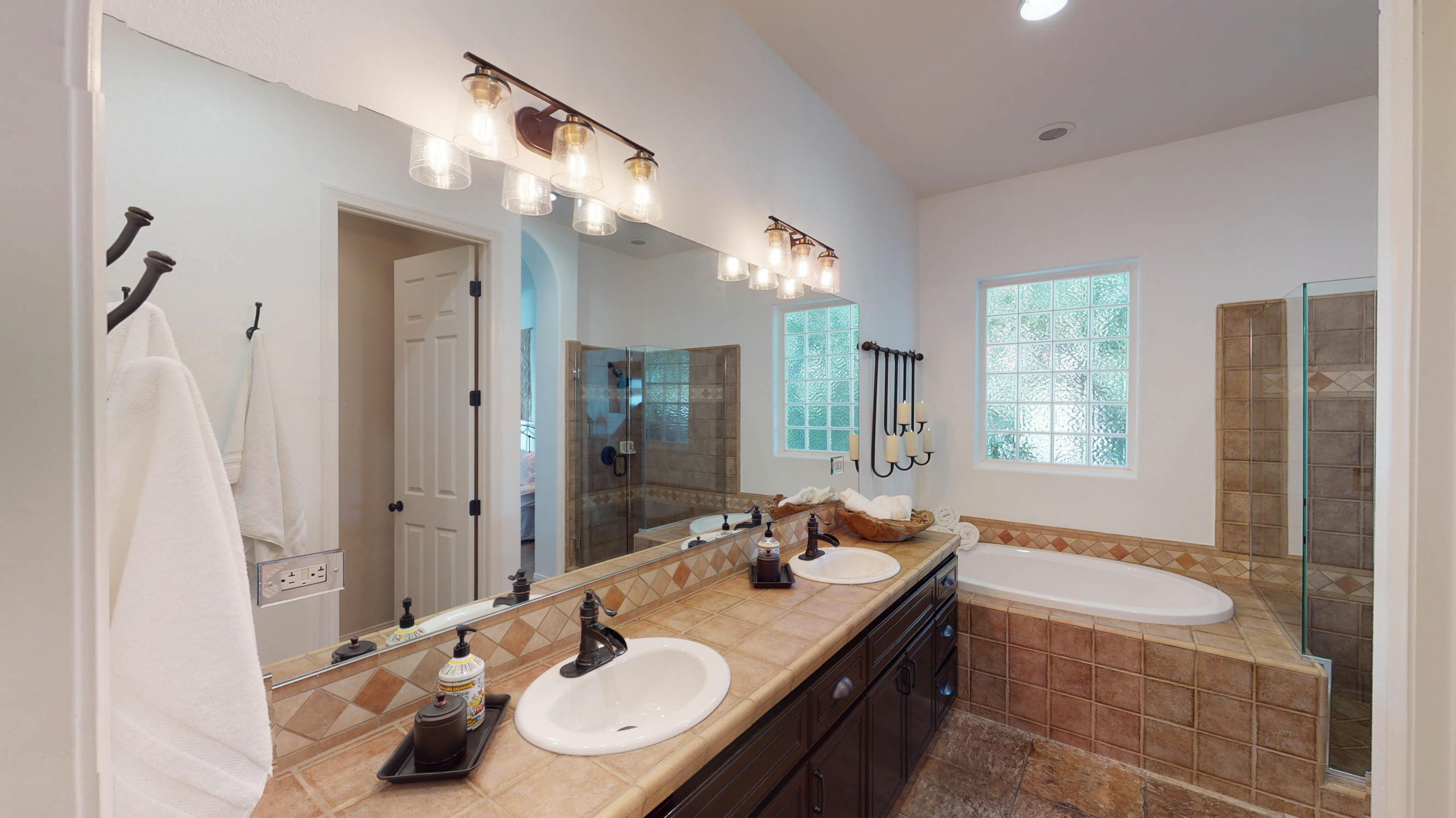 80777 Calle Azul La Quinta, CA 92253 - Photo 9 of 39 a bathroom with a granite countertop sink and a large mirror