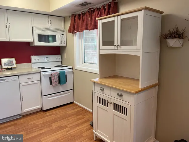 a kitchen with a stove and a microwave