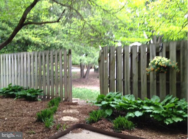 1502 Roundleaf Court Reston, VA 20190 - Photo 10 of 23 Fenced Backyard Gate leads to common area