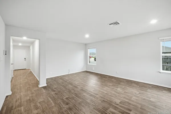 a view of an empty room and window