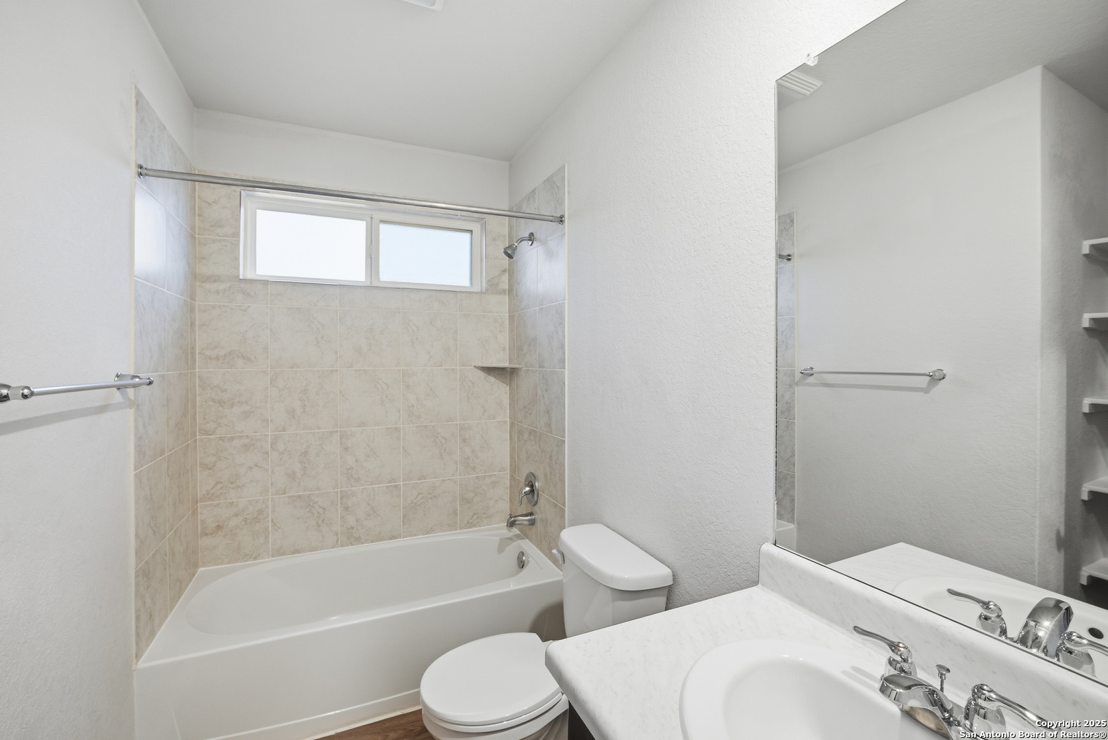 5803 Still River San Antonio, TX 78244 - Photo 5 of 15 a bathroom with a bathtub toilet and sink