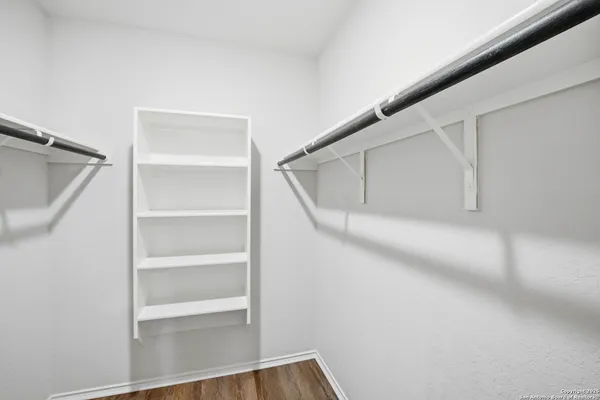 a view of an empty walk in closet