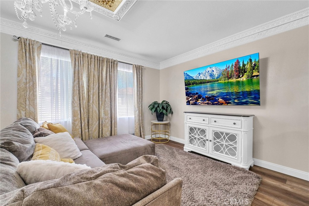 11499 Bridgeway Drive Riverside, CA 92505 - Photo 37 of 70 a living room with furniture and a flat screen tv