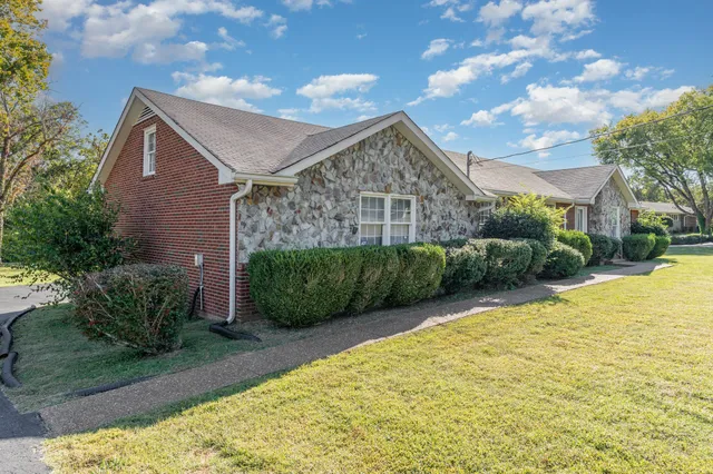a front view of a house with garden