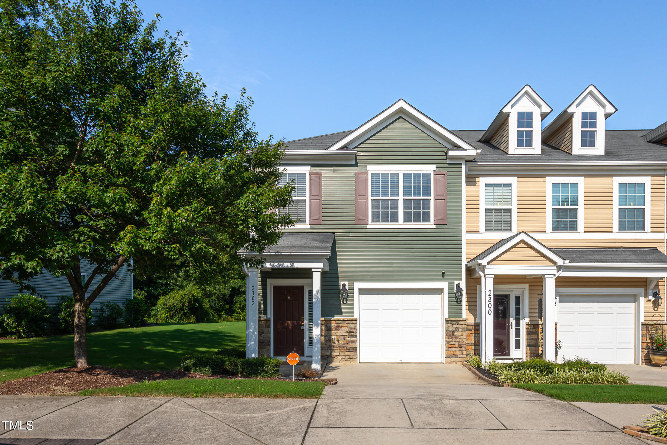 2302 Stoney Spring Drive Raleigh, NC 27610 - Photo 1 of 27 a front view of a house with garden