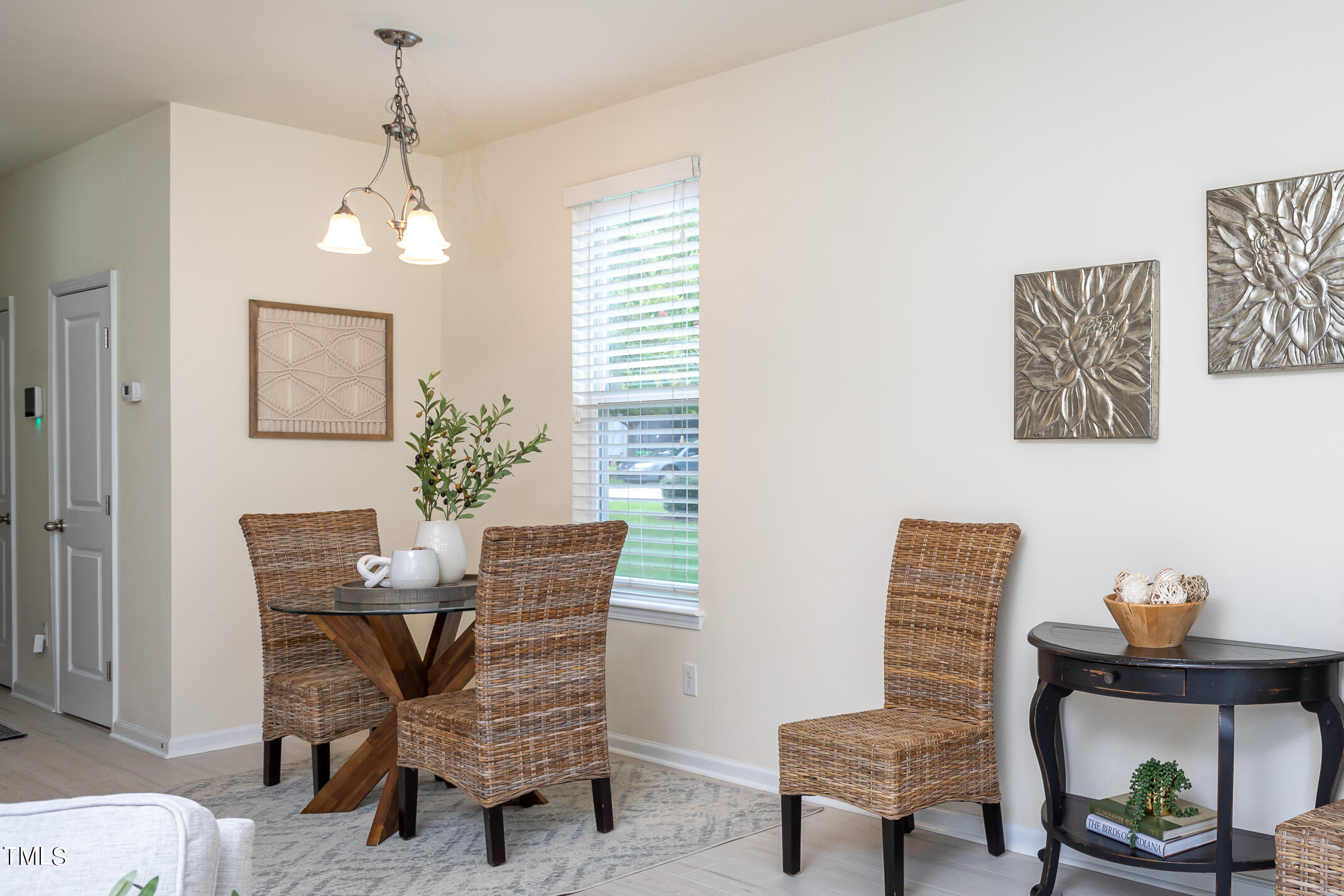 2302 Stoney Spring Drive Raleigh, NC 27610 - Photo 12 of 27 a view of a dining room with furniture and a potted plant