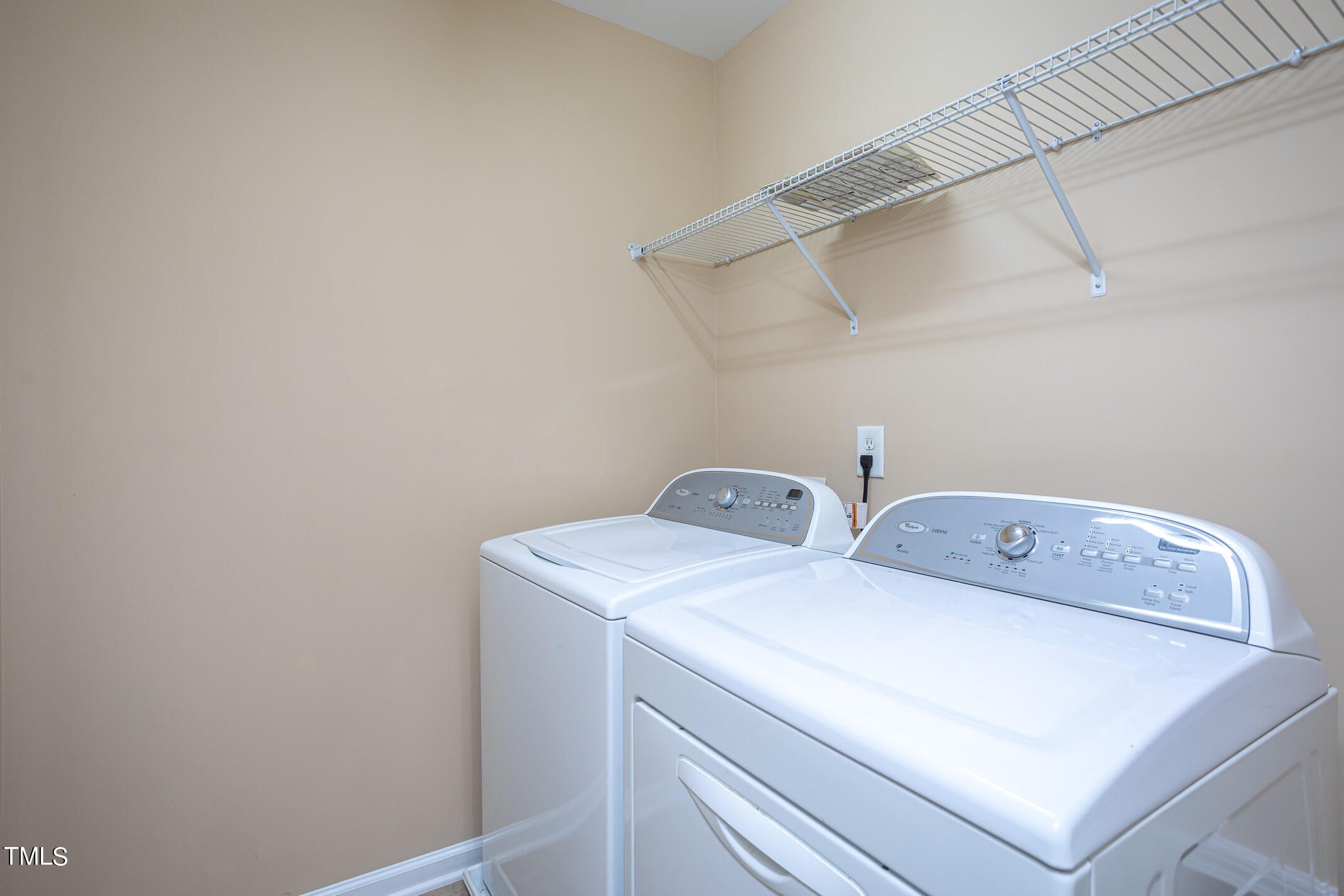 2302 Stoney Spring Drive Raleigh, NC 27610 - Photo 18 of 27 a utility room with dryer and washer