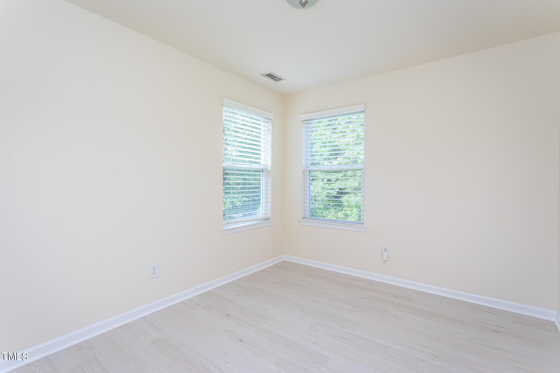 2302 Stoney Spring Drive Raleigh, NC 27610 - Photo 19 of 27 an empty room with a window