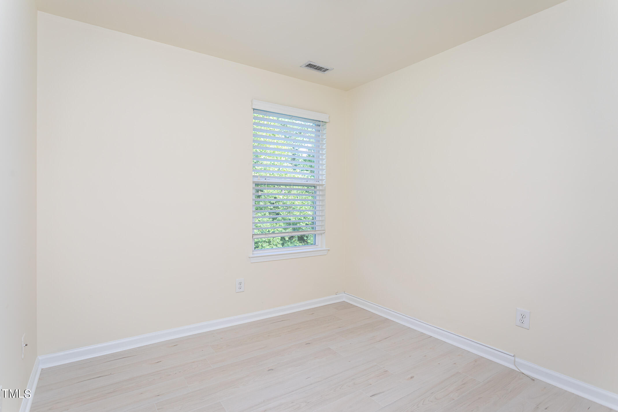 2302 Stoney Spring Drive Raleigh, NC 27610 - Photo 20 of 27 an empty room with a window