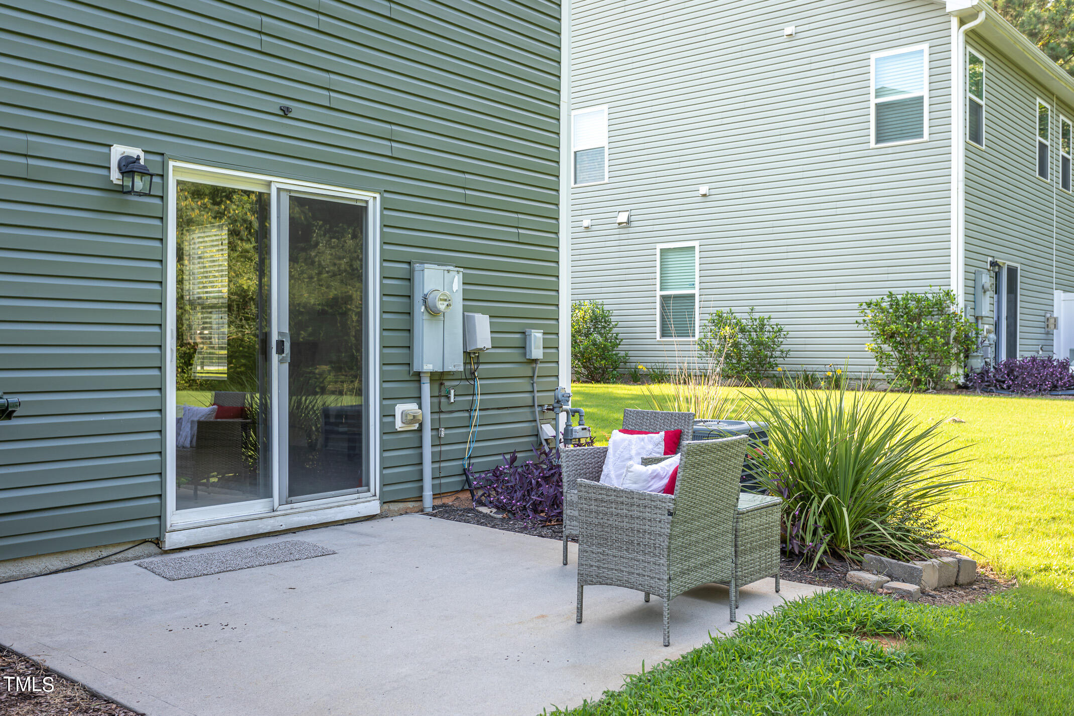 2302 Stoney Spring Drive Raleigh, NC 27610 - Photo 23 of 27 a garden view with a seating space
