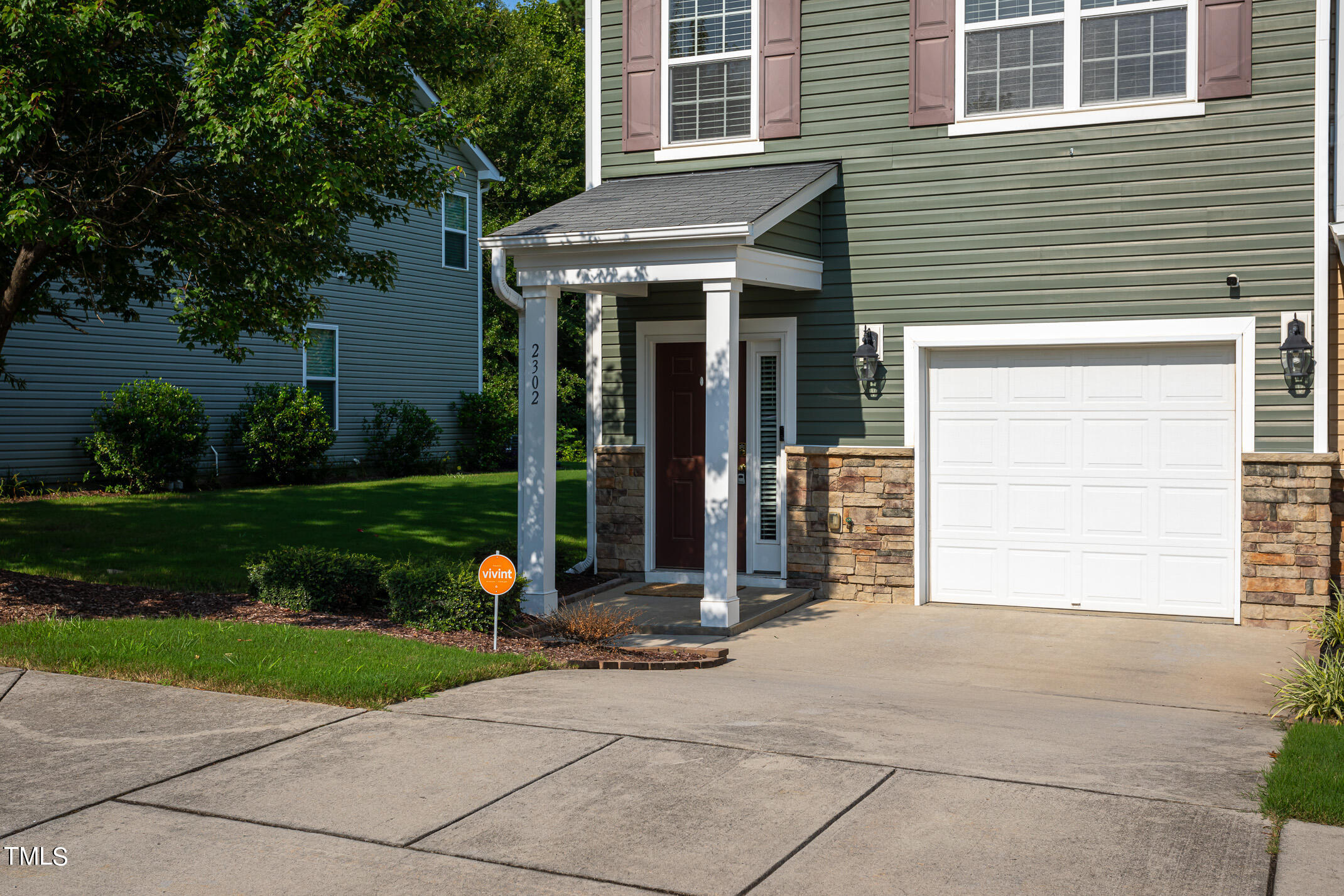 2302 Stoney Spring Drive Raleigh, NC 27610 - Photo 26 of 27 a front view of a house with garden