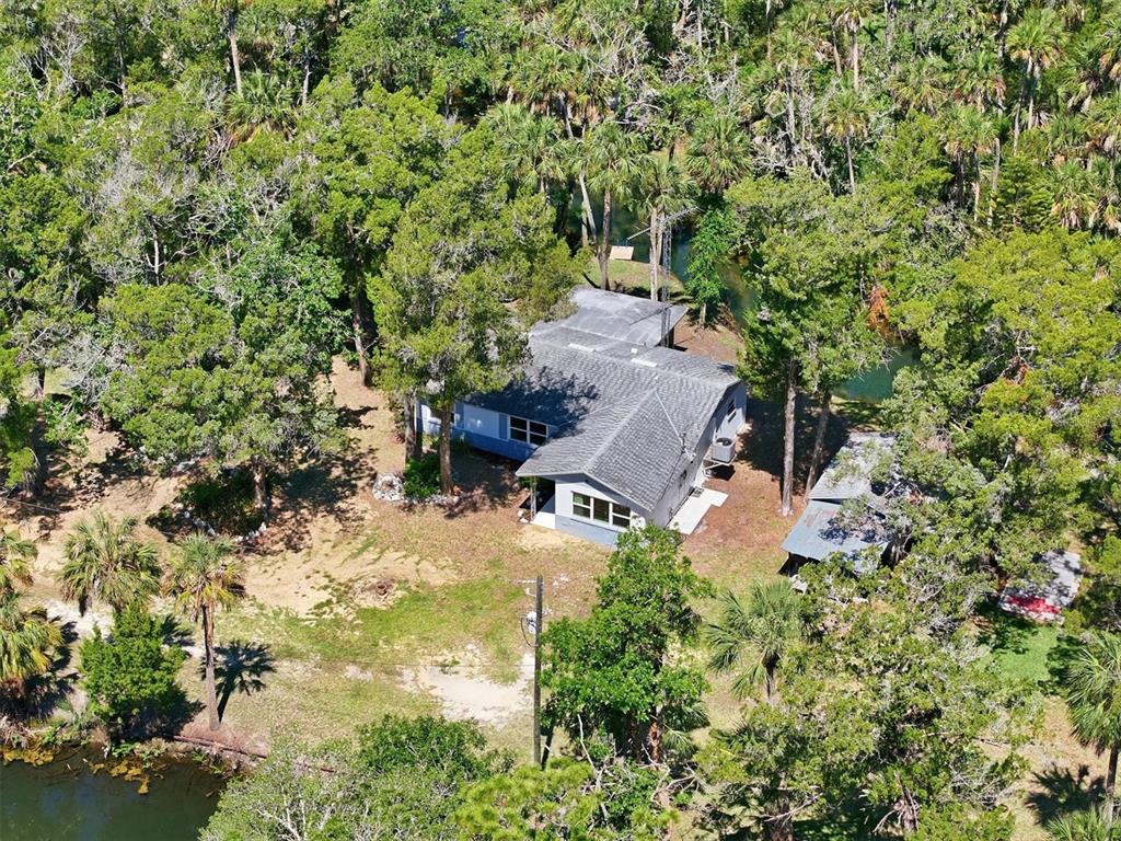6244 Colony Circle Weeki Wachee, FL 34607 - Photo 31 of 60 an aerial view of a house with yard swimming pool and outdoor seating