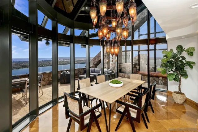 a view of a dining room with furniture window and outside view