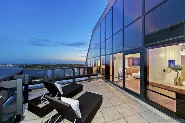 a spacious bathroom with a granite countertop sink a mirror and shower