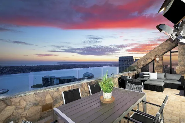 a view of city from balcony with seating space