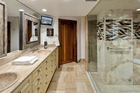 a living room with furniture and floor to ceiling windows