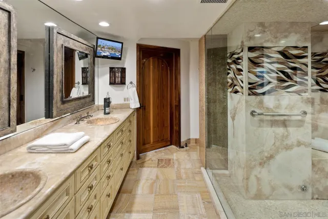 a living room with furniture and floor to ceiling windows