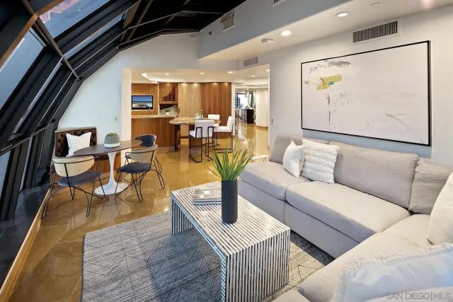 a bedroom with a bed and a chair