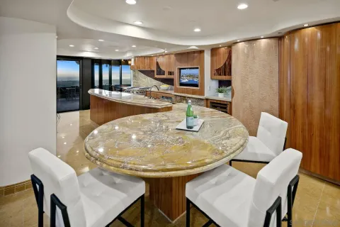 a bathroom with a tub shower sink and mirror