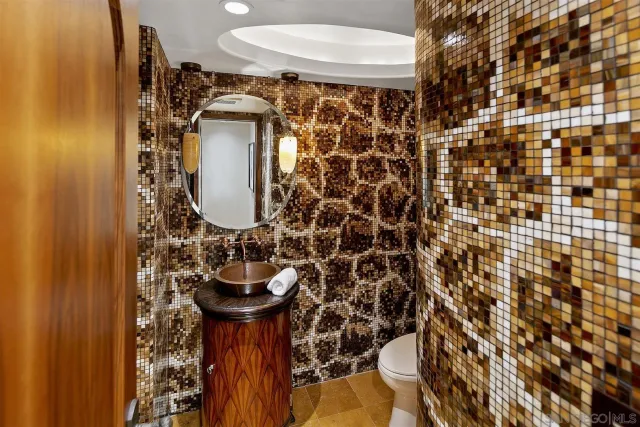 a view of a patio with table and chairs potted plants and palm trees
