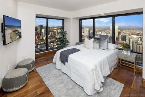 a living room with furniture a projector and a flat screen tv