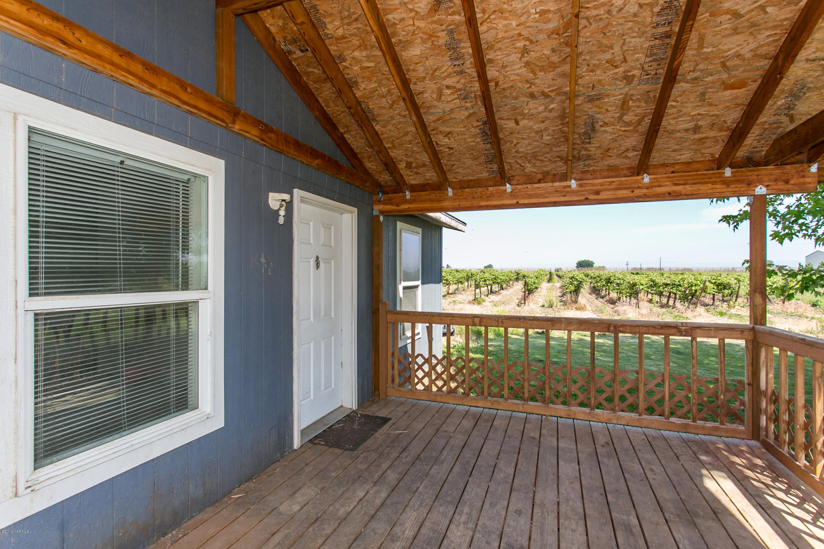 1263 Mountainview Road Grandview, WA 98930 - Photo 2 of 19 a view of balcony with wooden floor