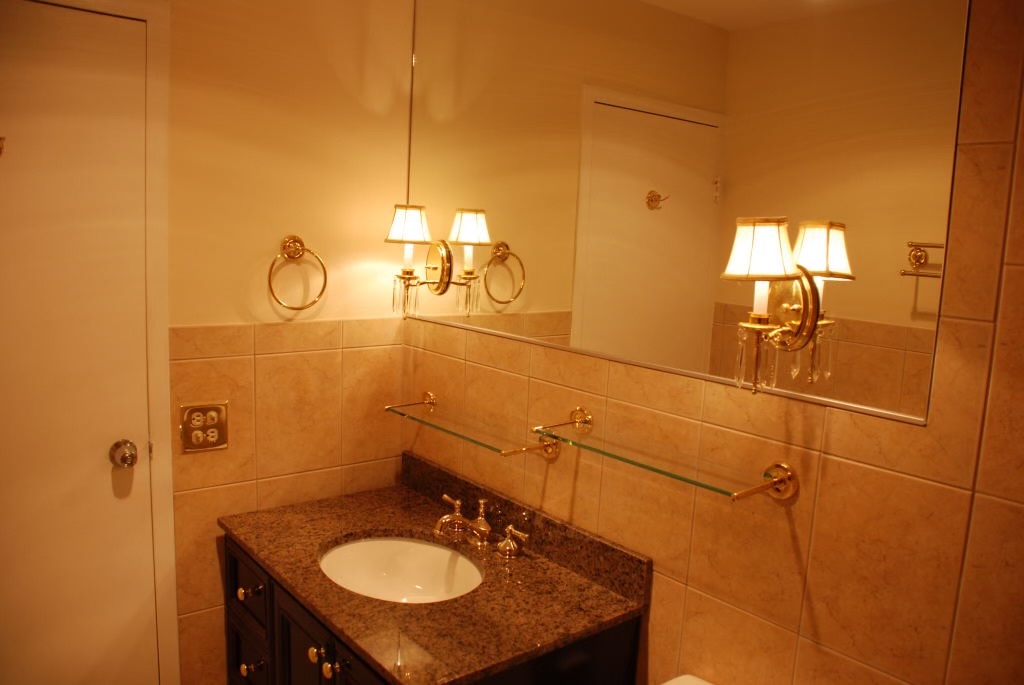 5445 North Sheridan Road, Unit 3012 Chicago, IL 60640 - Photo 7 of 8 a bathroom with a sink mirror and vanity