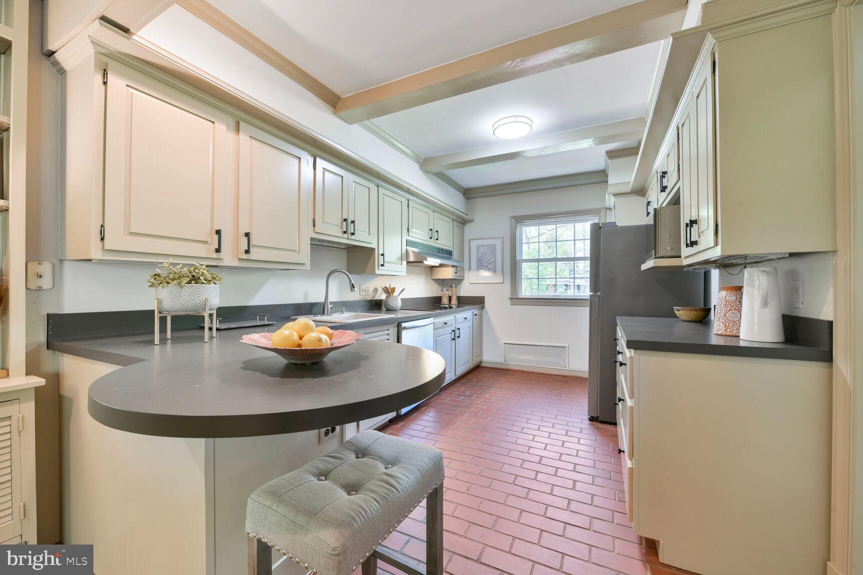 9111 Hamilton Drive Fairfax, VA 22031 - Photo 11 of 63 a kitchen with stainless steel appliances granite countertop a sink a stove and a refrigerator
