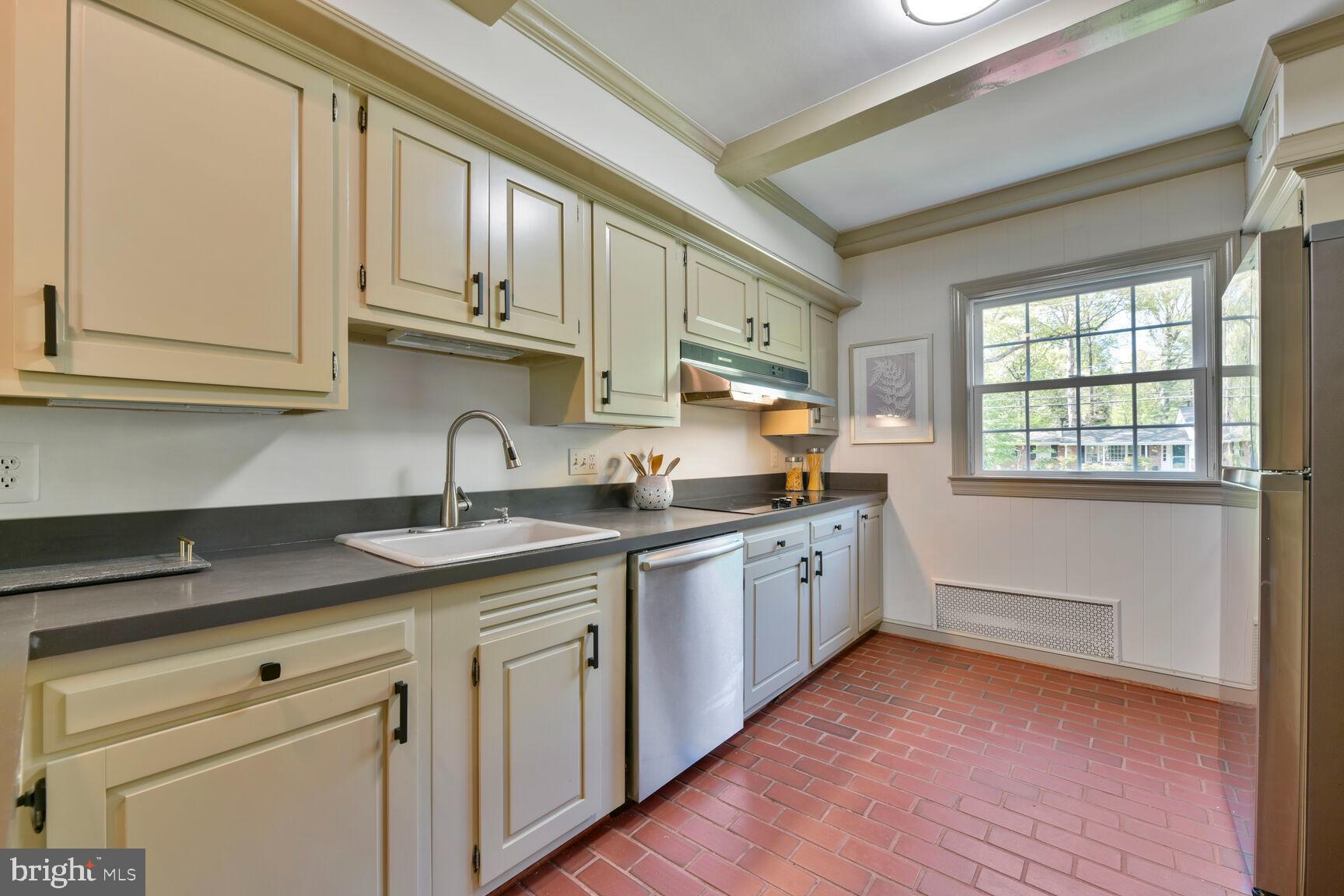 9111 Hamilton Drive Fairfax, VA 22031 - Photo 12 of 63 a kitchen with granite countertop stainless steel appliances a sink and cabinets