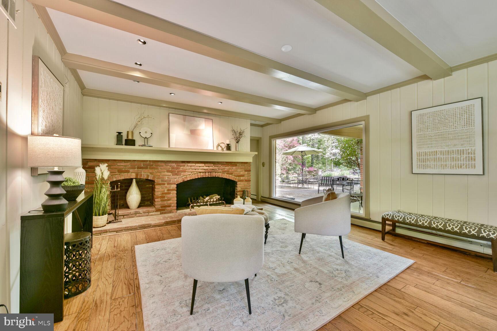 9111 Hamilton Drive Fairfax, VA 22031 - Photo 15 of 63 a living room with furniture and a fireplace