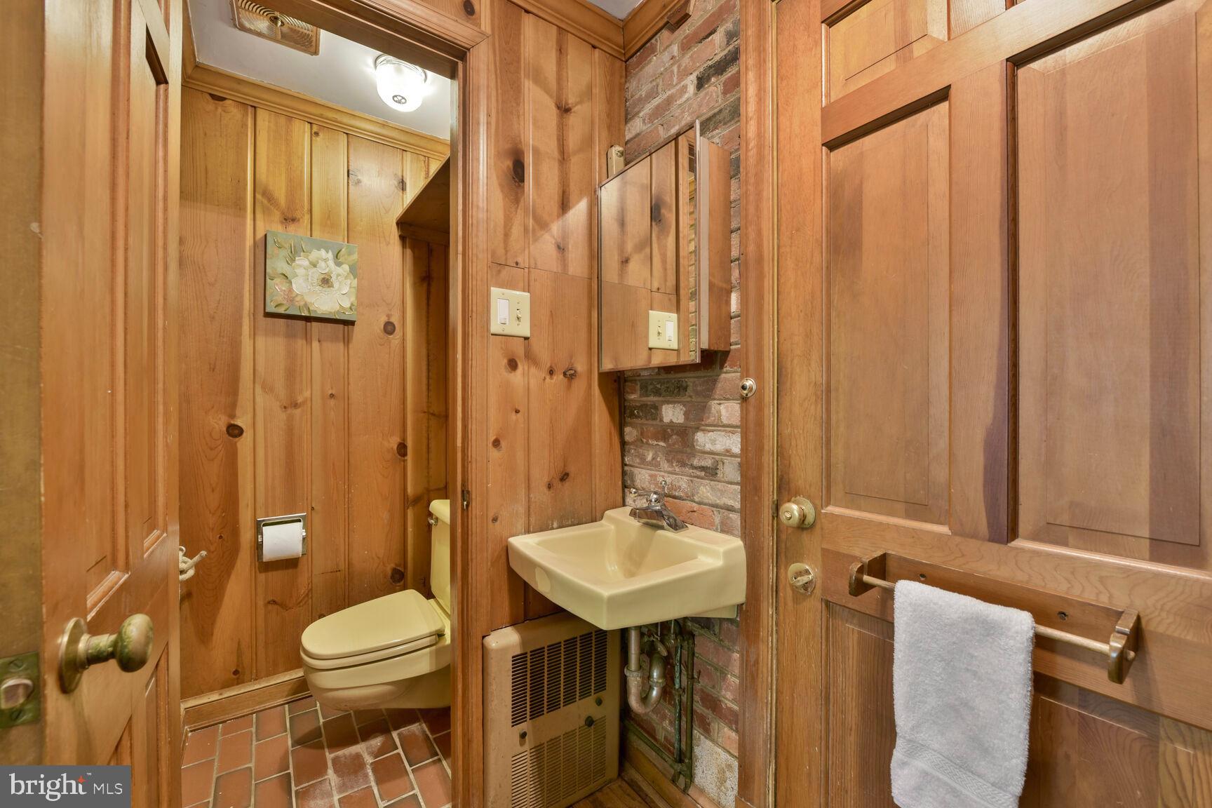 9111 Hamilton Drive Fairfax, VA 22031 - Photo 18 of 63 a bathroom with a sink a toilet and shower