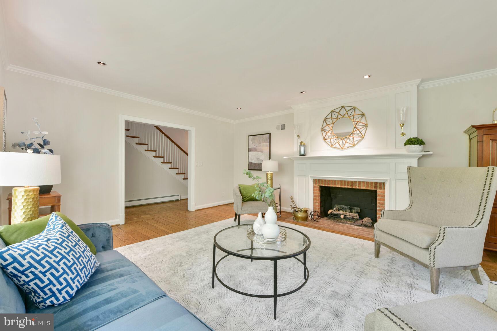 9111 Hamilton Drive Fairfax, VA 22031 - Photo 21 of 63 a living room with furniture and a fireplace