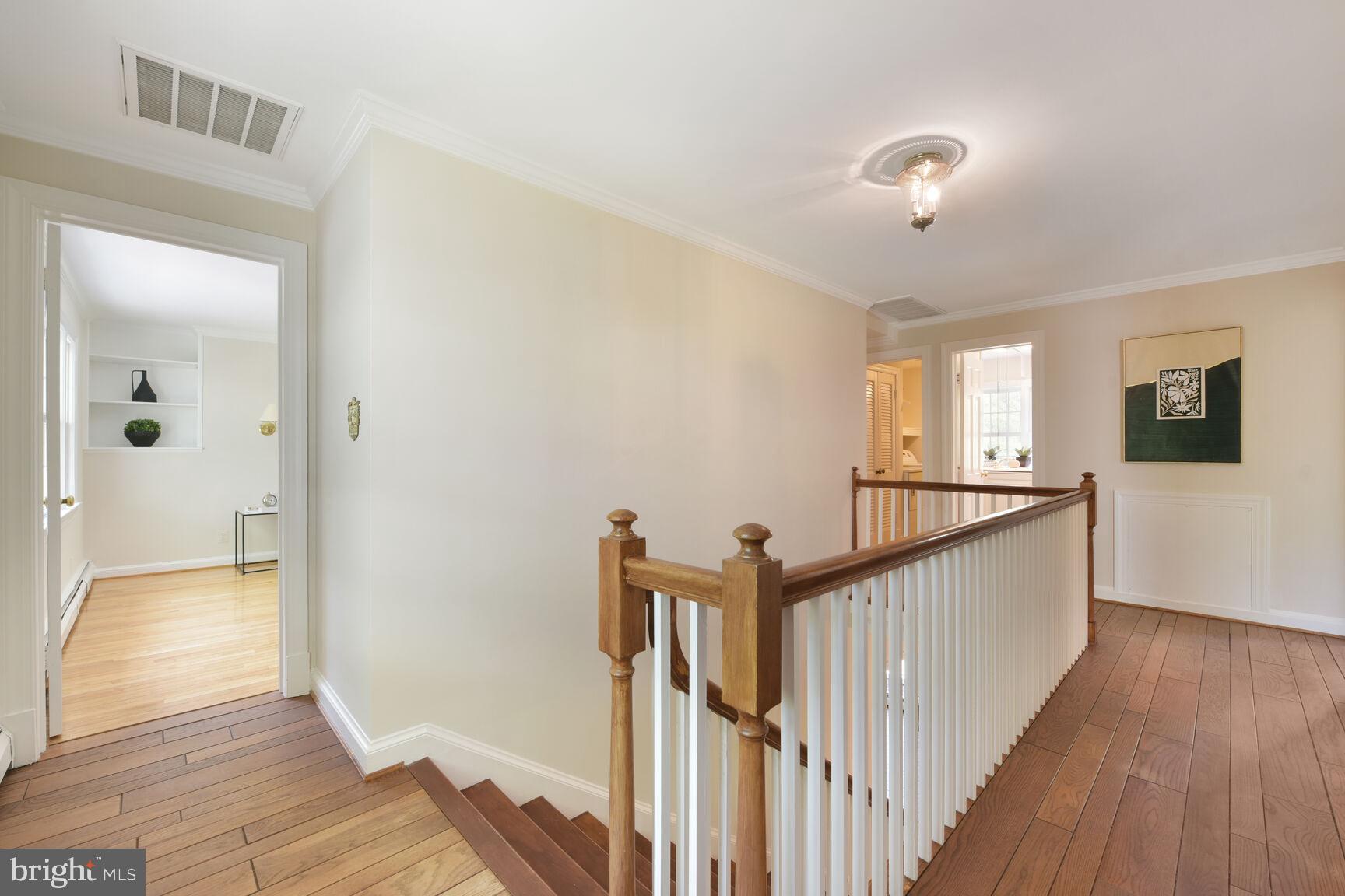 9111 Hamilton Drive Fairfax, VA 22031 - Photo 25 of 63 a view of a hallway view with wooden floor and staircase