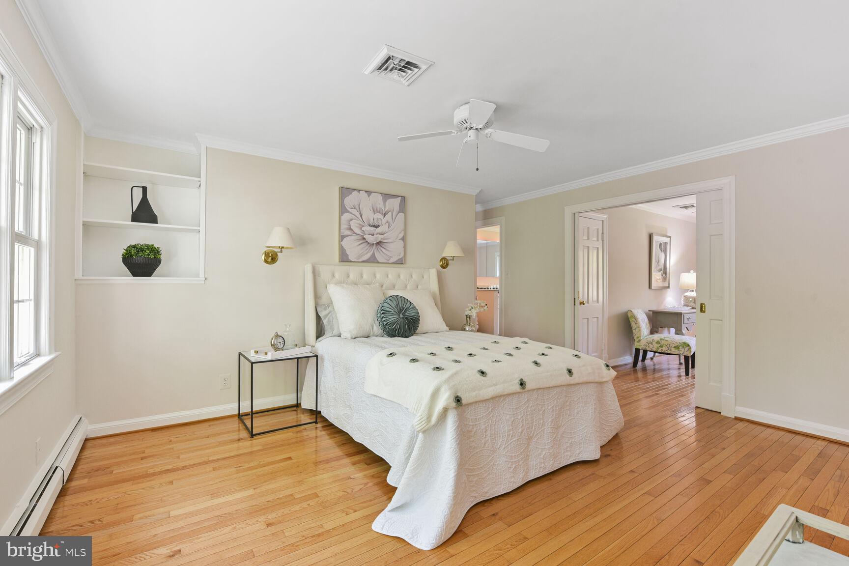 9111 Hamilton Drive Fairfax, VA 22031 - Photo 27 of 63 a bedroom with a bed and wooden floor
