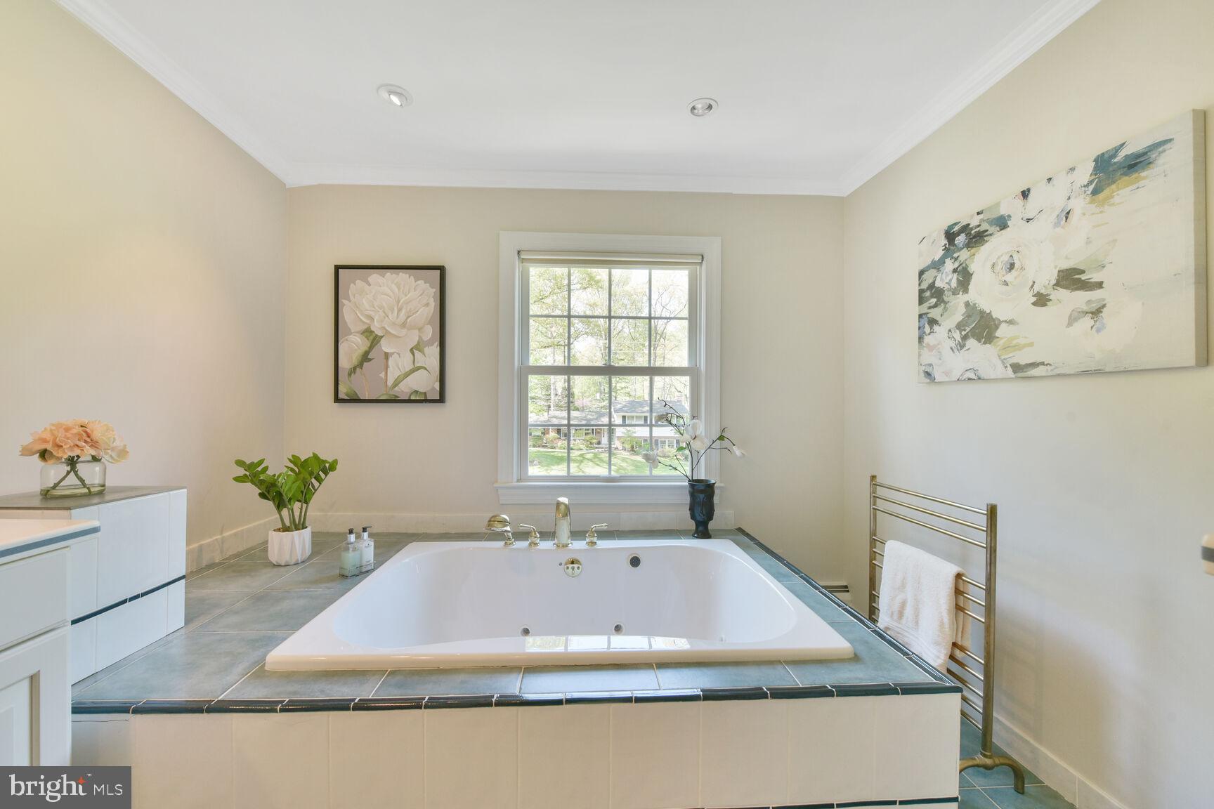 9111 Hamilton Drive Fairfax, VA 22031 - Photo 31 of 63 a bathroom with a tub and window