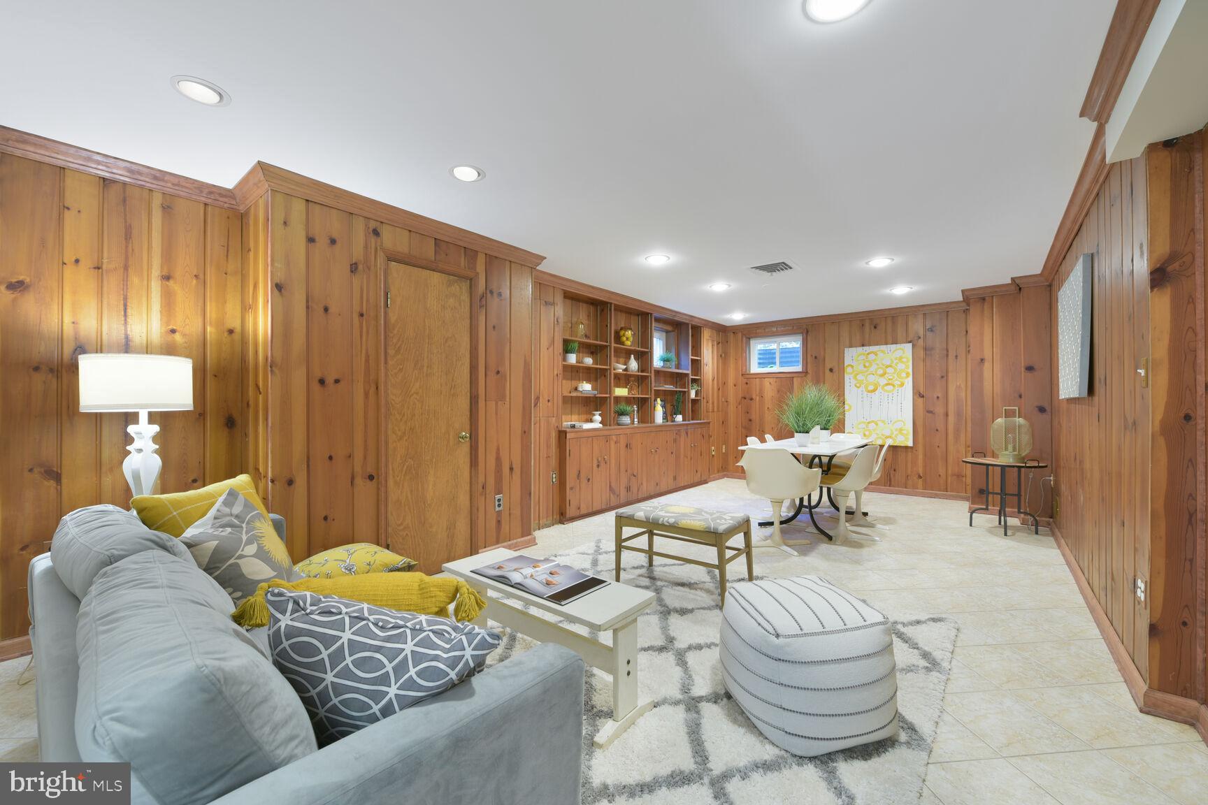 9111 Hamilton Drive Fairfax, VA 22031 - Photo 39 of 63 a living room with furniture and a table