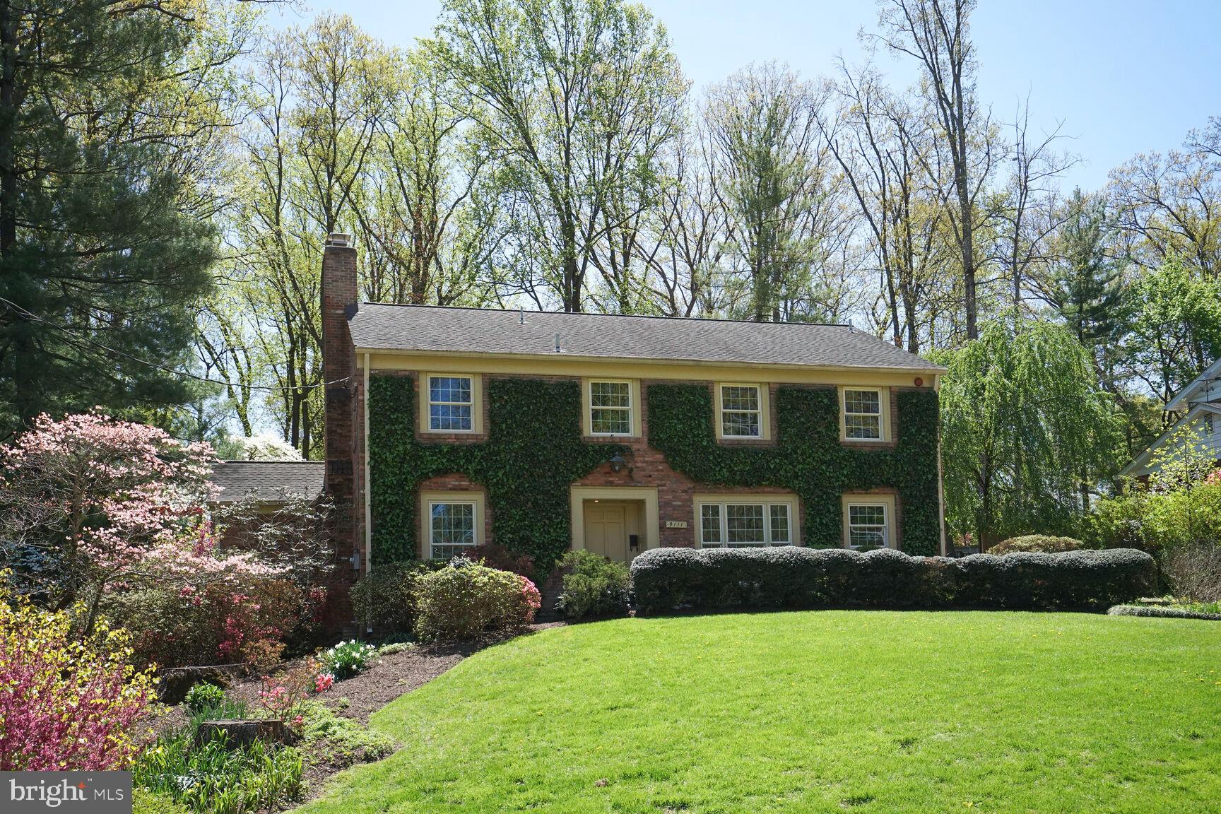 9111 Hamilton Drive Fairfax, VA 22031 - Photo 4 of 63 a front view of a house with a yard