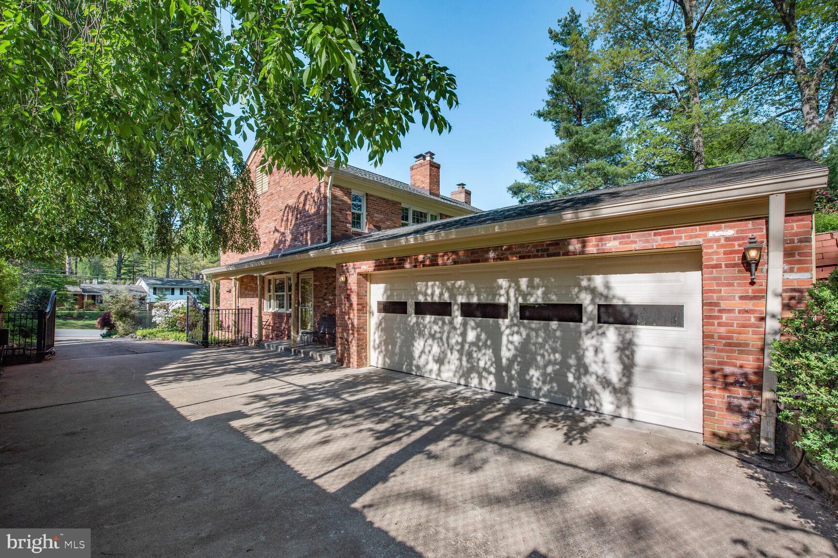 9111 Hamilton Drive Fairfax, VA 22031 - Photo 47 of 63 a front view of a house with a yard