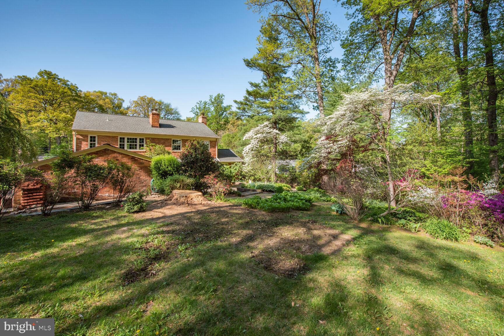 9111 Hamilton Drive Fairfax, VA 22031 - Photo 55 of 63 a view of a house with a yard and sitting area