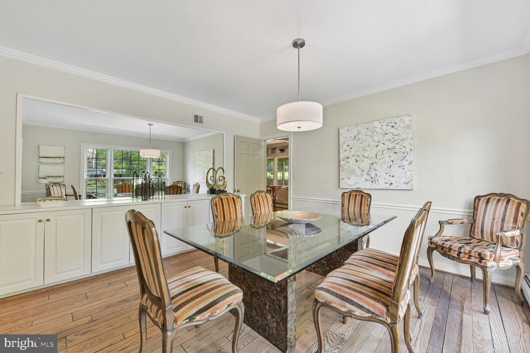 9111 Hamilton Drive Fairfax, VA 22031 - Photo 7 of 63 a view of a dining room and livingroom with furniture wooden floor a chandelier