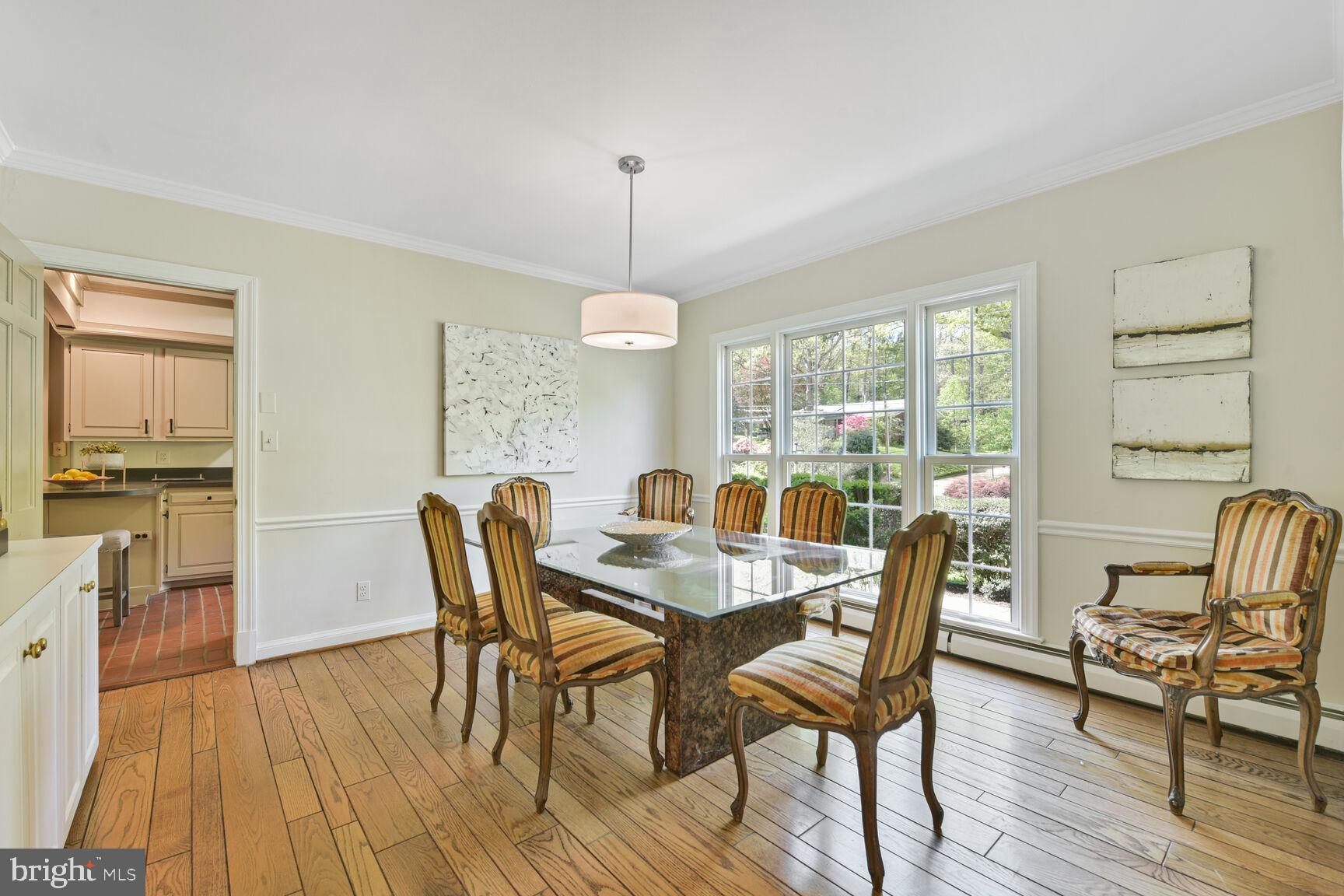 9111 Hamilton Drive Fairfax, VA 22031 - Photo 8 of 63 a view of a dining room with furniture window and wooden floor