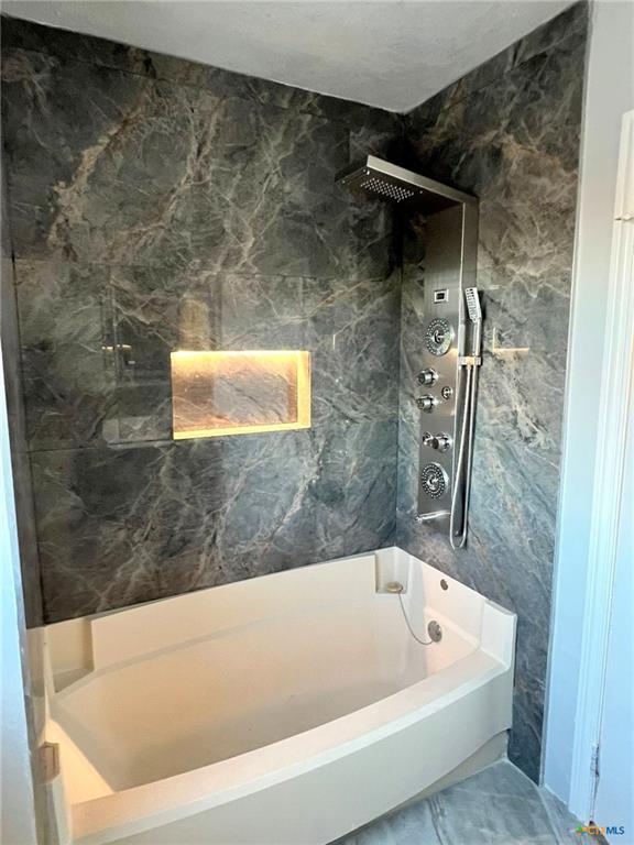 805 Sissom Road Killeen, TX 76541 - Photo 14 of 35 Full bath featuring shower / washtub combination and tile walls