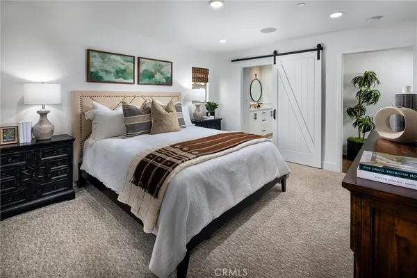a bedroom with bed and window
