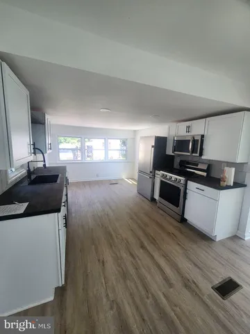 a white toilet sitting next to a bathroom sink