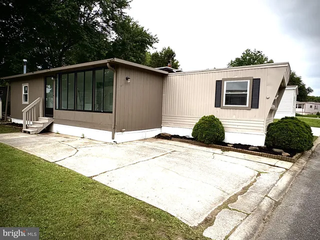 a view of backyard with wheel chair and potted plants